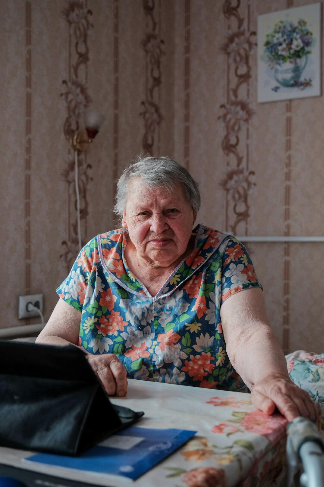elderly person using tablet